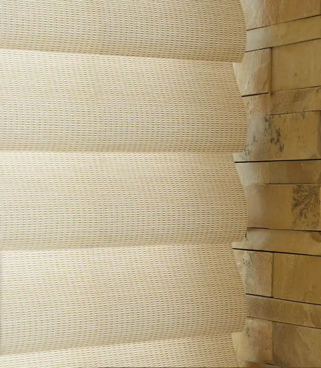 Elegant neutral curtains with a woven pattern fitting a cozy, natural interior design.