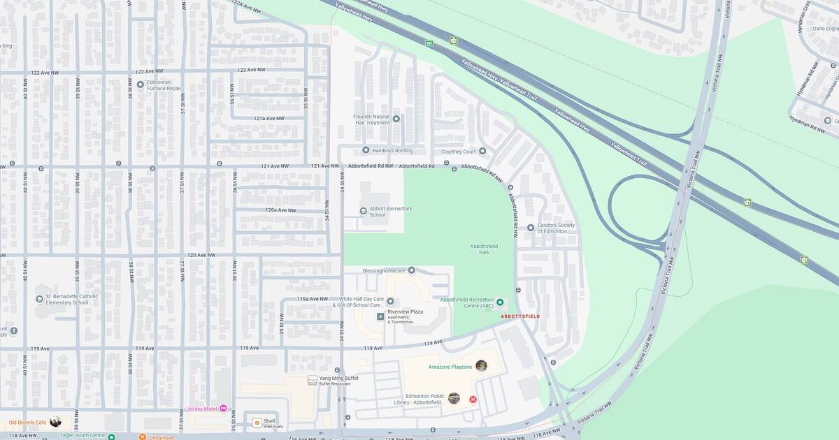 Sunset over Toronto skyline featuring the CN Tower and cityscape, with vibrant colors reflecting on Lake Ontario. A scenic view highlighting urban architecture and natural beauty.