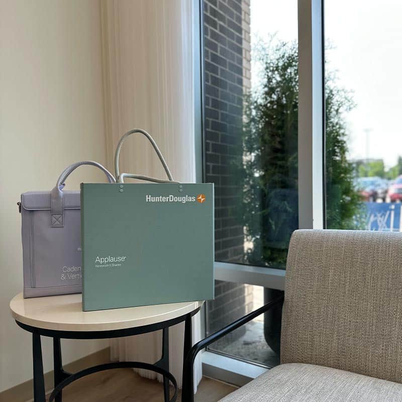 High-quality medical devices and informational materials arranged on a small table near a comfortable chair.