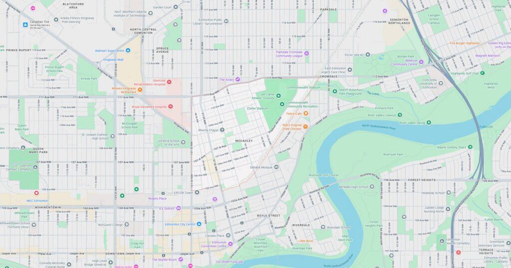 Detailed city map showing streets, parks, river, and public transit routes for navigation and urban planning.