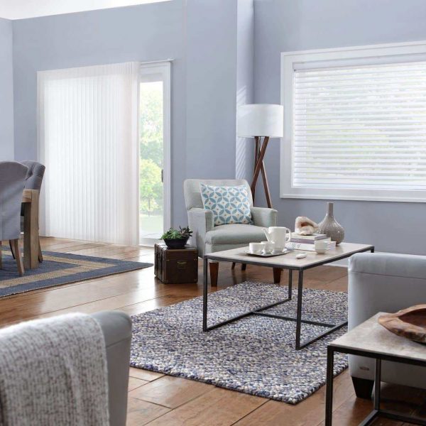 Bright living room with stylish blinds on windows, cozy seating, and modern decor for enhanced home comfort.