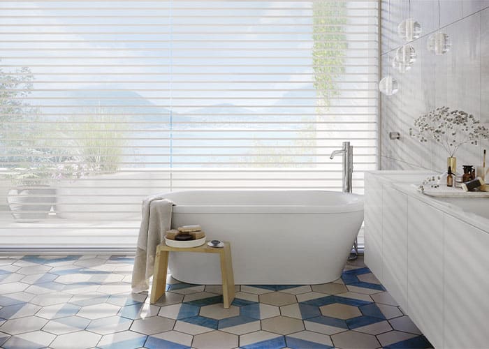 Luxurious bathroom with modern blinds and elegant white bathtub, featuring stylish decor and natural light. Ideal for showcasing window treatment solutions and bathroom design inspiration.