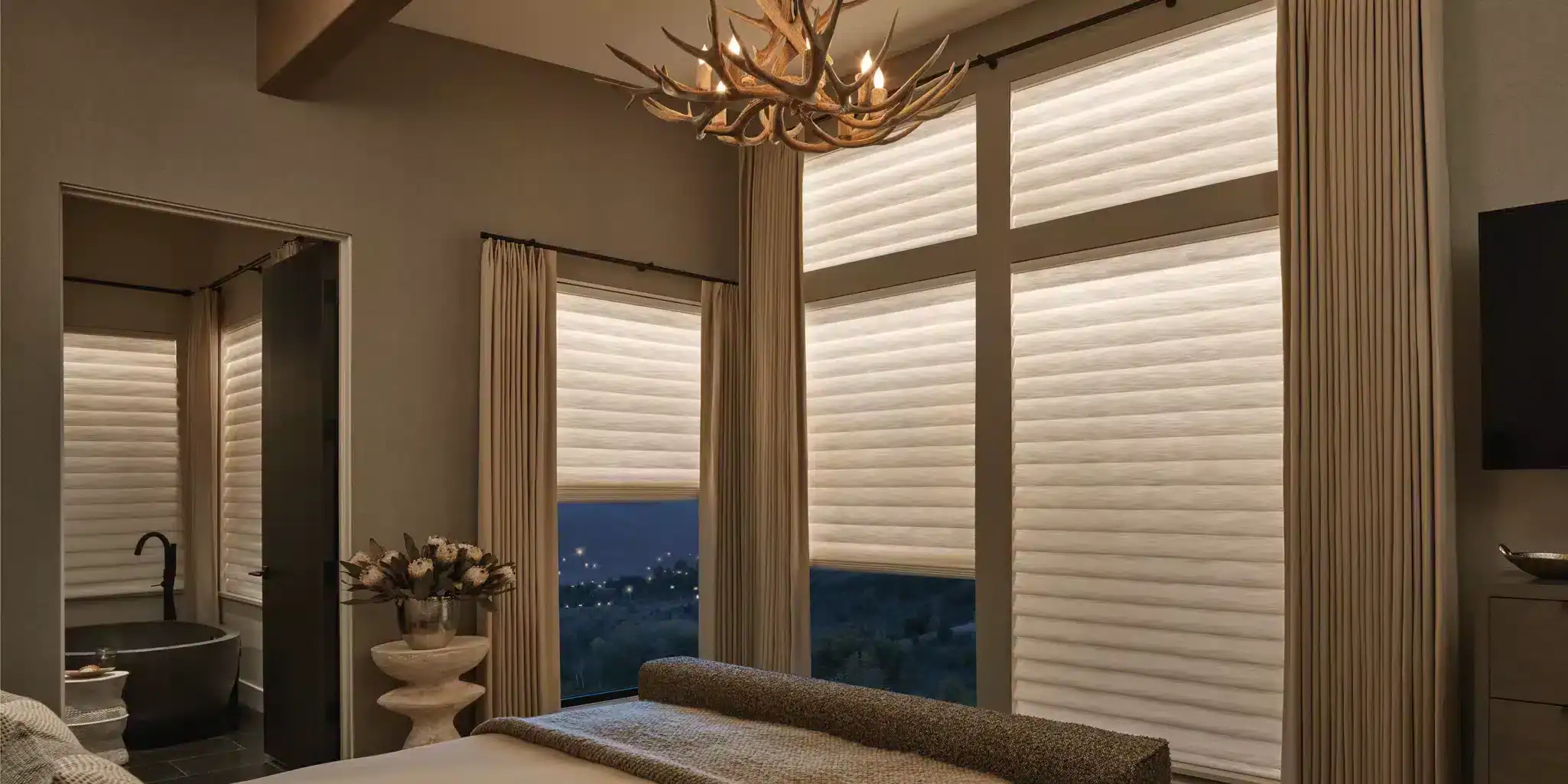 Elegant window blinds and drapery in a luxury bedroom, featuring custom-made shades and curtains to enhance privacy and light control. Perfect for home decor and interior design.