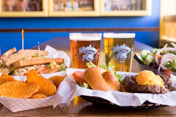 Sandwich, buffalo fries, burger with cheese, salad, two pints of beer