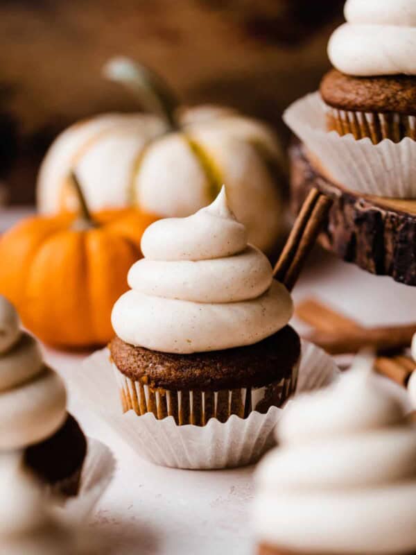 Pumpkin cupcakes frosted with swirls of brown butter cream cheese frosting.