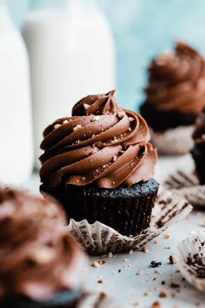 A chocolate cupcake topped with swirls of nutella frosting.