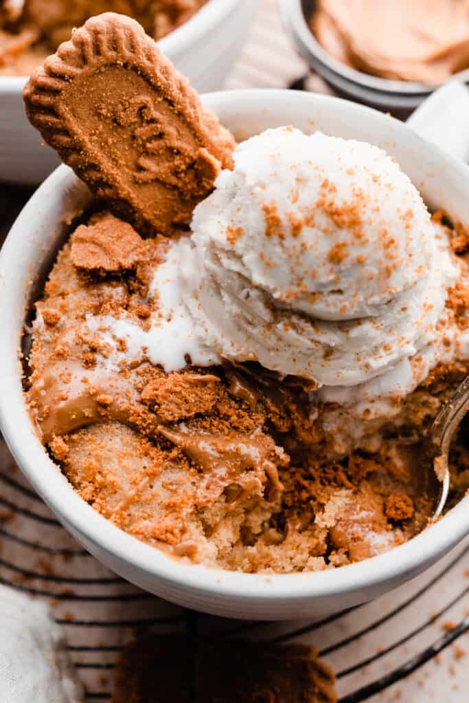 A close-up of the mug cake with a bite missing.
