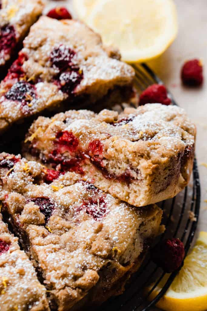 A slice of the coffee cake, showing the raspberry rippled center and raspberries baked in.