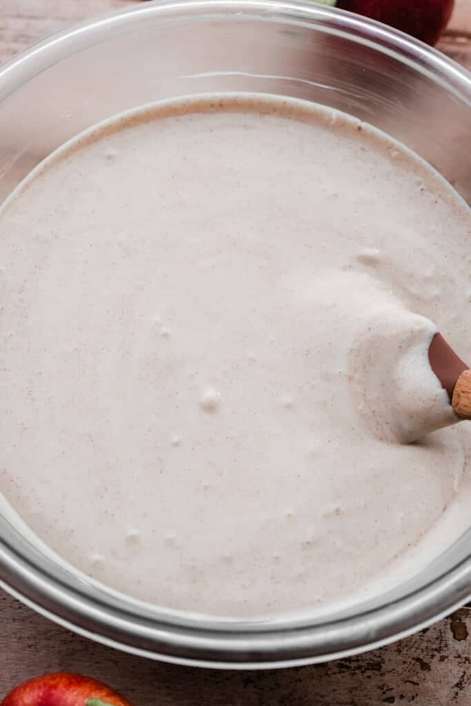 A bowl of cinnamon vanilla cheesecake batter.