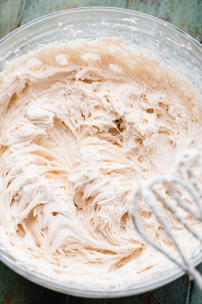 A bowl of brown butter cream cheese frosting.