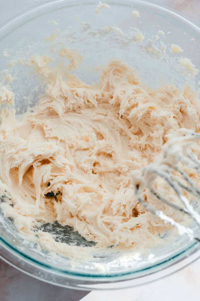 A bowl of the creamed butter and powdered sugar.