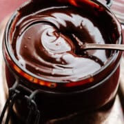 A jar of silky hot fudge sauce.