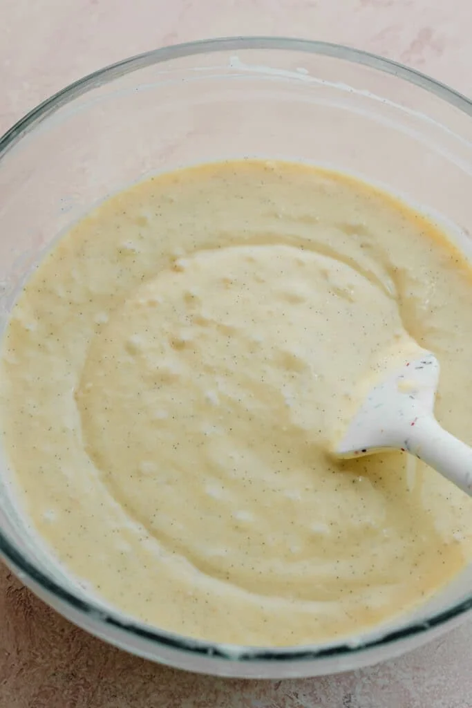A bowl of silky, semi-thin lemon cupcake batter.