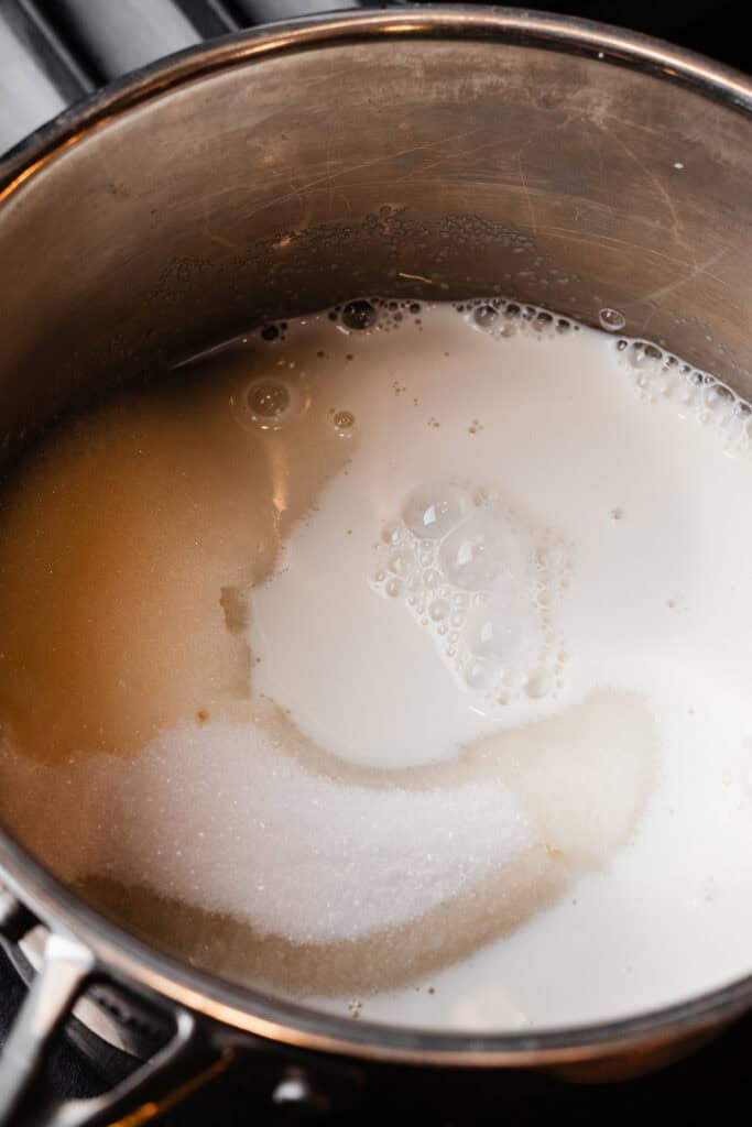Sugar and milk in a saucepan.