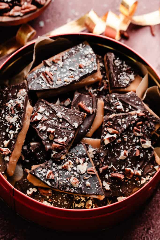 Pieces of homemade toffee in a vintage Christmas tin.
