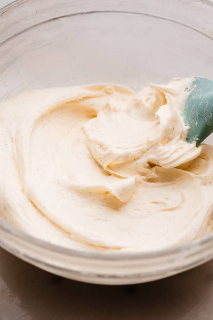 A mixing bowl of cream cheese frosting.