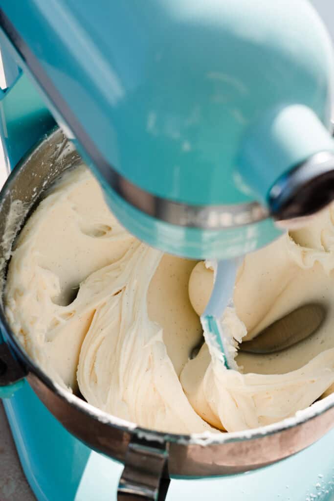 A stand mixer full of silky cream cheese frosting.