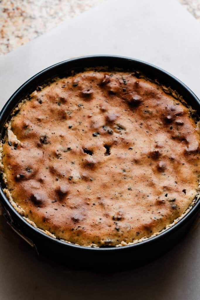 The baked, cooled, and chilled cheesecake in the pan.