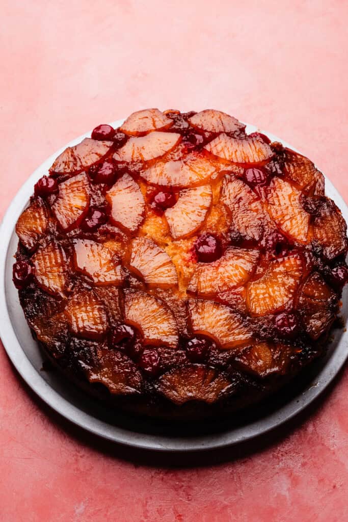 The baked cake on a cake plate.