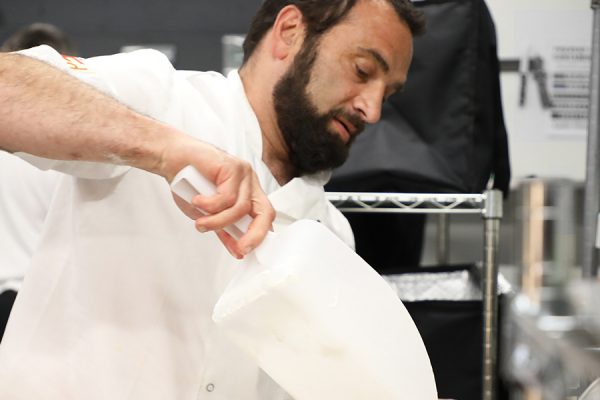 Chef preparing seafood dish in Dundee at BlueCoo Creative.