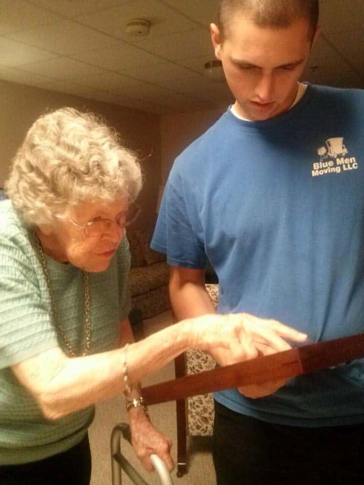 Elderly woman receiving help with moving tasks from a professional mover in Columbus, Ohio.