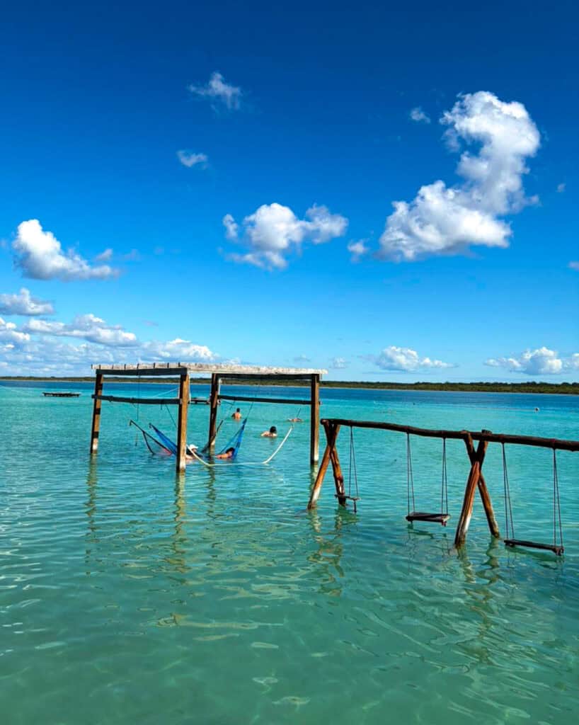 Swings and hammocks over the Lagoon of 7 Colours in Bacalar, mexico