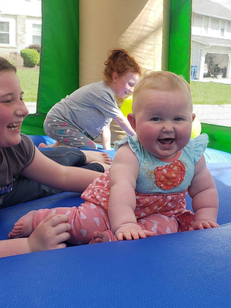Kids having fun in a bounce house rental in O'fallon, MO