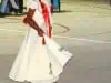 A young solo performer shyly enchants the crowd with her dance..