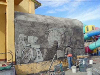 Mexican muralist at work