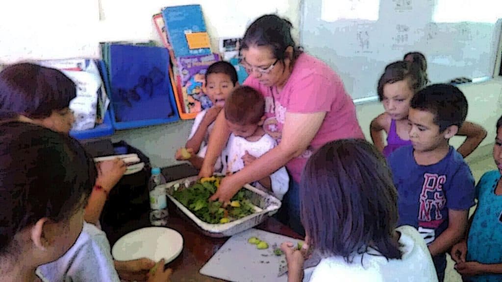 kids prepare fresh salad