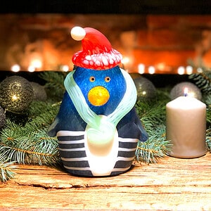Christmas Pingu is a cute glass penguin with a Christmas hat and scarf.