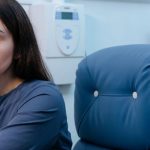 A woman patient in a medical setting at Brain Performance Technologies, a center specializing in non-invasive brain treatments like MeRT for autism and brain health.