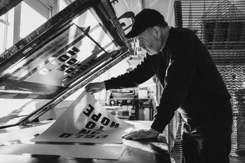 Anthony Burrill's four giant letters, the branding move that made Glastonbury a beacon of hope