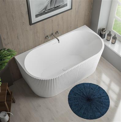 Sleek modern freestanding bathtub with ribbed exterior design in a contemporary bathroom setting, perfect for luxury custom bathroom renovations.