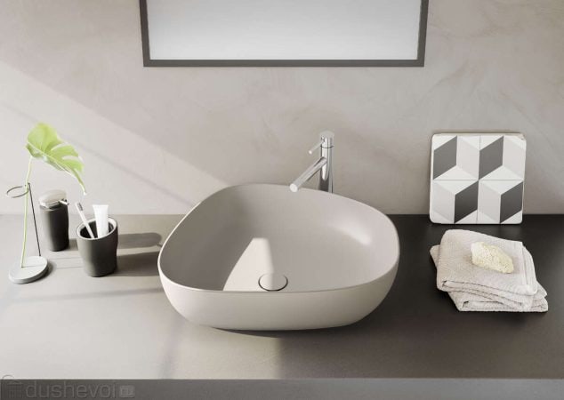 Contemporary bathroom vanity with a sleek oval sink, minimalist accessories, and neutral color palette highlighting modern kitchen and bathroom design.