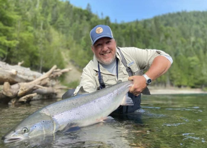 angler holding trophy Atlantic Salmon in Gaspé Quebec