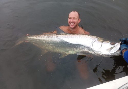 Angler holding Tarpon caught at Skimmer Island in Cabinda Angola