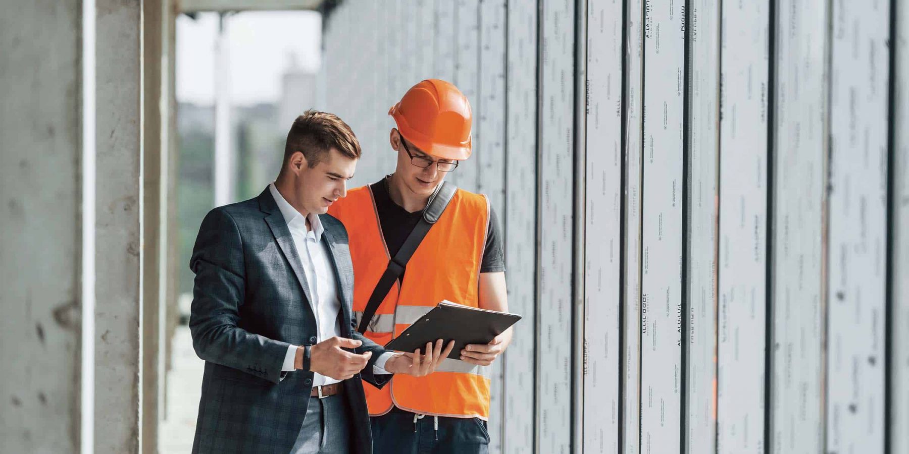 with-documents-man-in-suit-and-handyman-in-orange-JELANKS.jpg