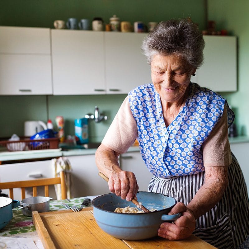 Senior woman baking
