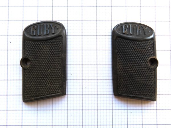 Old Ruby gun grips with textured surface, suitable for vintage firearm enthusiasts.