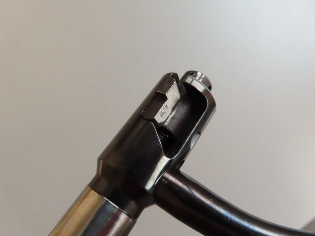 Close-up of firearm chamber and barrel for ammunition use.