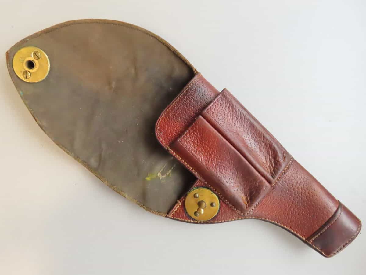 A vintage leather ammunition pouch from Colonial Ammunition Company, New Zealand, designed for hunters and shooters to carry bullets securely.