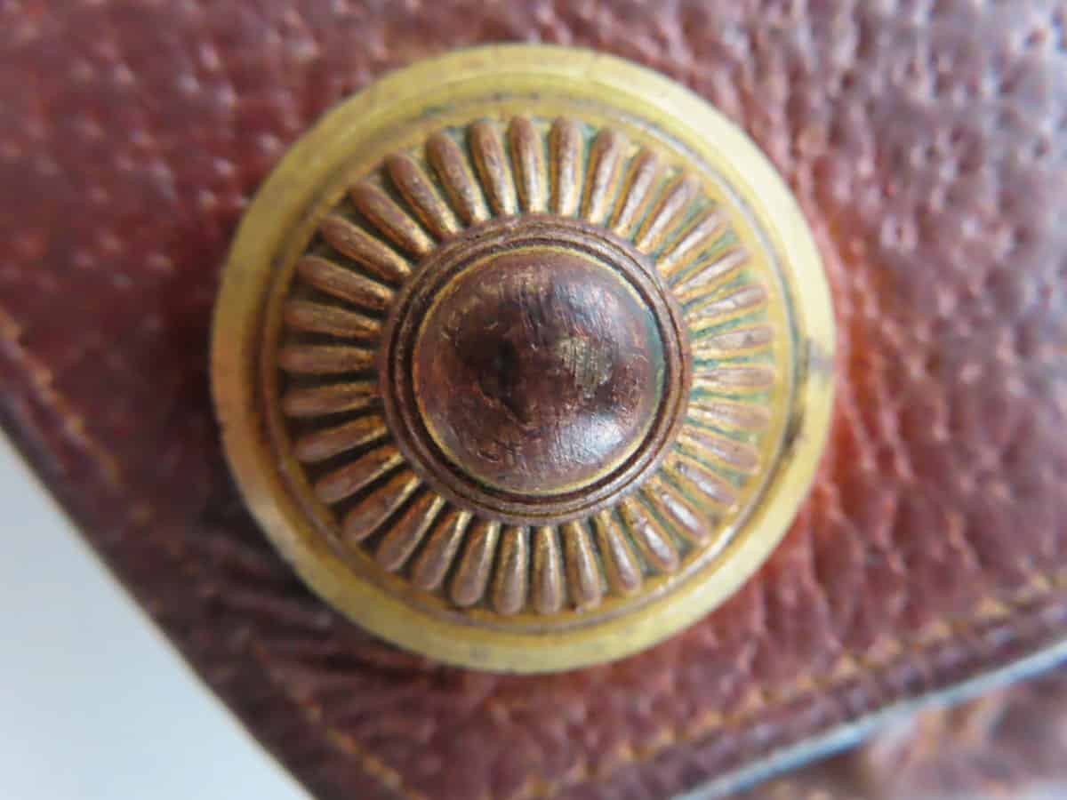 Close-up of antique brass bullet cap, historical ammunition collectible piece in New Zealand.