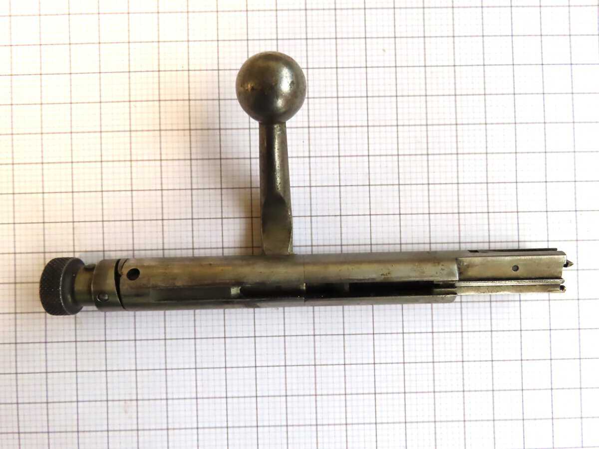 Antique bullet puller tool from Colonial Ammunition Company, used for safely removing bullets from cartridges.