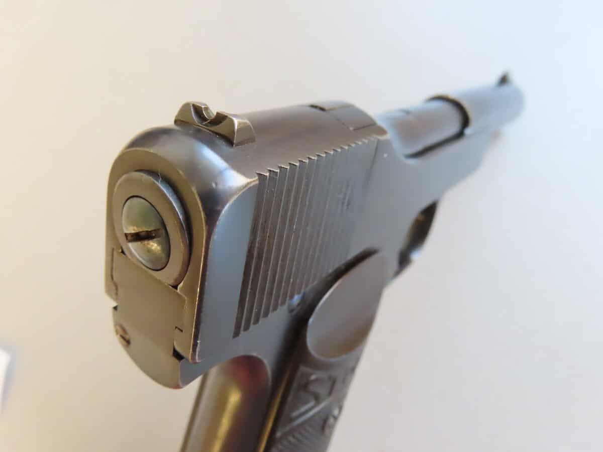 Close-up of a vintage pistol showcasing precision firearm craftsmanship.