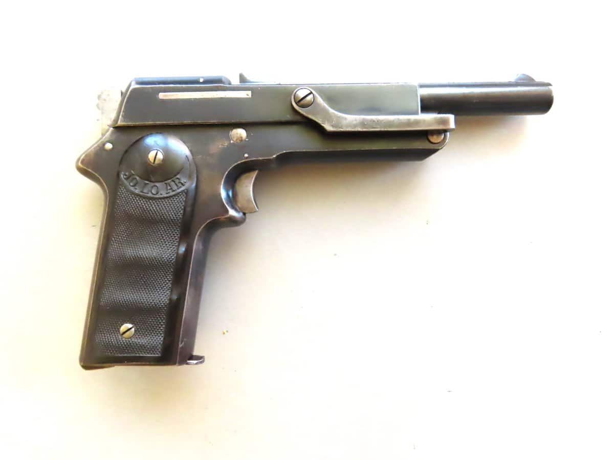 Old firearm from Colonial Ammunition Company. Vintage style handgun with metal grip.