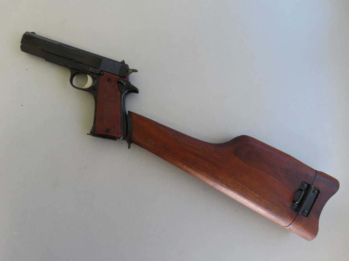 Old firearm with wooden stock and metal slide, perfect for firearm enthusiasts and collectors.