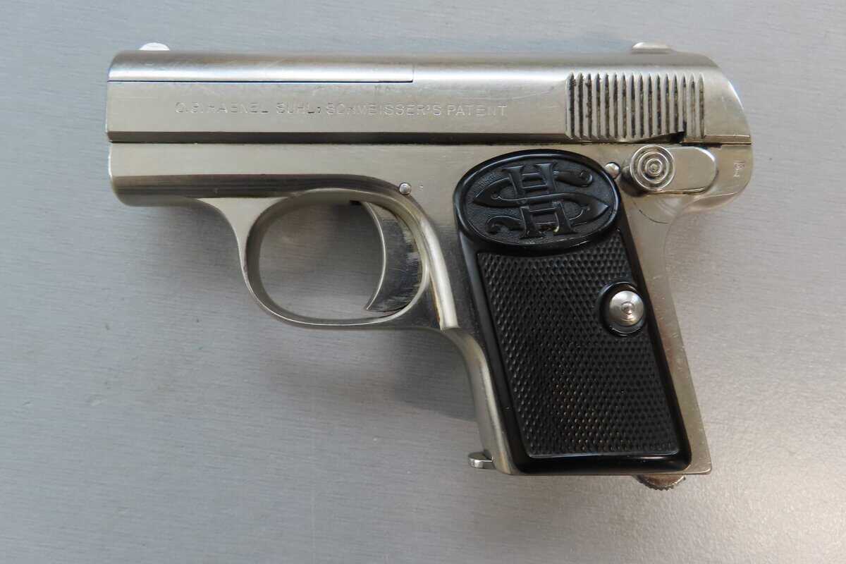 Detailed replica of a vintage pistol with branding and patent markings.