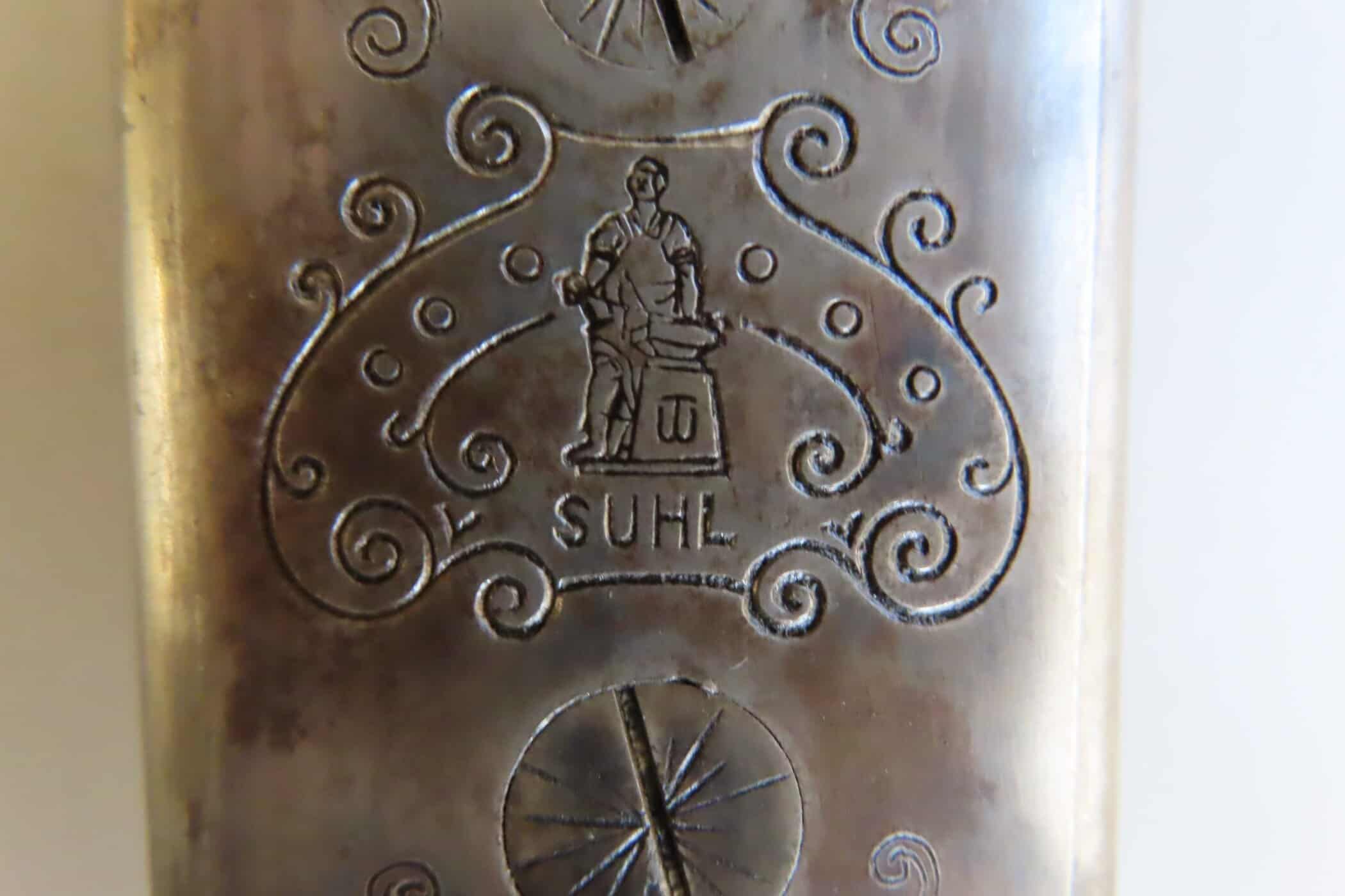 Vintage ammunition manufacturer's mark and engraving for authentic firearm use.