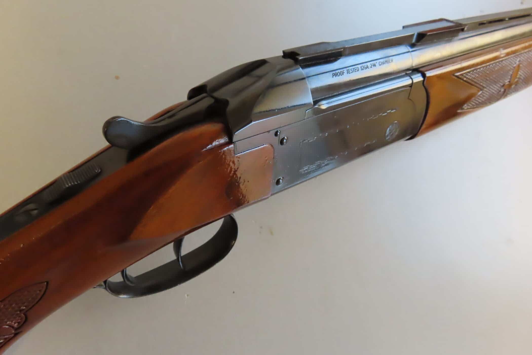 High-quality close-up of a classic gun with wooden stock and metal barrel for hunting or collection.